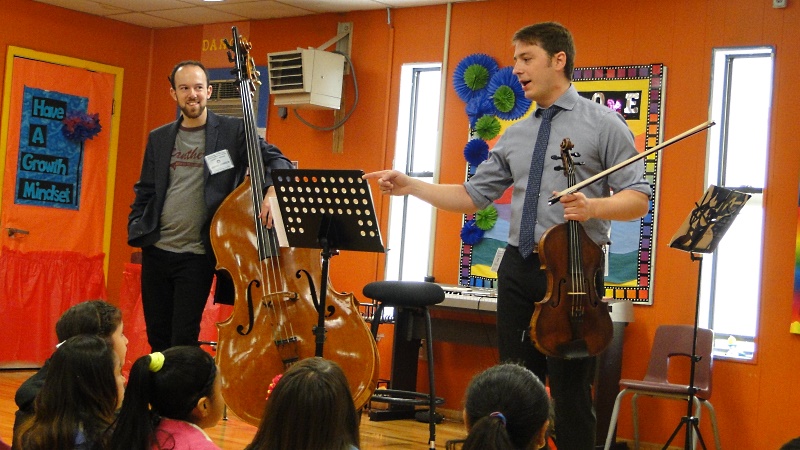 Houston Symphony Community-Embedded Musicians David Connor (bass) and Anthony Parce (viola) teach students at Crespo Elementary